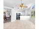 Open-concept living area showcases tile floors, seamlessly connecting living, dining, and kitchen at 484 Sherwood Oaks Rd, Orange City, FL 32763