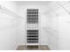 Bright walk-in closet with custom shelving and hanging racks for optimal storage solutions at 484 Sherwood Oaks Rd, Orange City, FL 32763