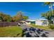 Fenced backyard with garage and outbuilding in the rear at 501 Powers Ave, Port Orange, FL 32127