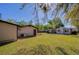 Lush backyard showcasing a shed, inviting patio, and verdant green space at 501 Powers Ave, Port Orange, FL 32127