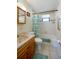 Bathroom with a bathtub and a shower curtain with a leaf pattern at 501 Powers Ave, Port Orange, FL 32127