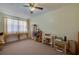 Bedroom with a ceiling fan and window offering natural light creating a cozy ambiance at 501 Powers Ave, Port Orange, FL 32127