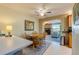 Dining area adjacent to the living room with a decorative brick archway at 501 Powers Ave, Port Orange, FL 32127