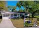 Charming one-story home featuring a well-maintained lawn, complementing the property's inviting curb appeal at 501 Powers Ave, Port Orange, FL 32127