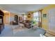 Cozy living room with carpet, brick accent wall, comfortable seating, and great natural light at 501 Powers Ave, Port Orange, FL 32127