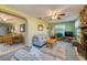 Open-concept living room connected to a dining area and featuring a stone fireplace at 501 Powers Ave, Port Orange, FL 32127