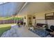 Covered patio with seating, grill and a fenced-in backyard at 501 Powers Ave, Port Orange, FL 32127