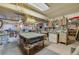 A well-equipped workshop offers abundant workspace with storage cabinets, worktables, and overhead lighting at 501 Powers Ave, Port Orange, FL 32127