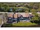 Aerial view of grey townhouses near a lake showing green space and curb appeal at 509 Lake Bridge Dr, Ormond Beach, FL 32174