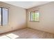 Bedroom with wood-look floors, a large window and beautiful natural light at 509 Lake Bridge Dr, Ormond Beach, FL 32174