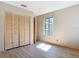 Cozy bedroom with wood-look floors and built-in closet storage at 509 Lake Bridge Dr, Ormond Beach, FL 32174
