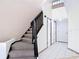 Spacious entryway with staircase, tile flooring, and multiple doors leading to other rooms at 509 Lake Bridge Dr, Ormond Beach, FL 32174