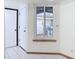 Bright entryway featuring neutral walls, tile flooring, and a front door with adjacent window at 509 Lake Bridge Dr, Ormond Beach, FL 32174