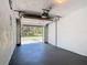 Spacious two car garage with high ceilings and a newly painted floor, located off the main house at 509 Lake Bridge Dr, Ormond Beach, FL 32174
