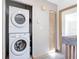 Laundry room featuring stacked washer and dryer at 509 Lake Bridge Dr, Ormond Beach, FL 32174