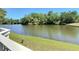 Scenic view overlooking a tranquil pond surrounded by lush greenery, creating a serene outdoor space at 509 Lake Bridge Dr, Ormond Beach, FL 32174