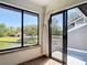 Bright sunroom with views of the lake, and a private deck overlooking the water at 509 Lake Bridge Dr, Ormond Beach, FL 32174