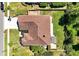 Bird's-eye view of a house featuring a well-maintained roof, expansive yard, and mature landscaping at 5808 Oak Lake Trl, Oviedo, FL 32765