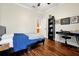 Bedroom with dark wood floors and a black desk and shelving unit at 5808 Oak Lake Trl, Oviedo, FL 32765