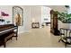 Elegant entry to billiards room featuring piano, grandfather clock, and potted plant at 5808 Oak Lake Trl, Oviedo, FL 32765