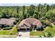 Well-maintained single-Gathering home with a three-car garage and beautiful landscaping, including palm trees at 5808 Oak Lake Trl, Oviedo, FL 32765