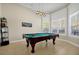 Home billiard room featuring bright windows and a striking billiards table at 5808 Oak Lake Trl, Oviedo, FL 32765