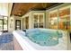 Outdoor hot tub is ready for relaxing evenings with it's wood plank base at 5808 Oak Lake Trl, Oviedo, FL 32765