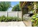 Outdoor grilling area with a stainless steel grill and brick floor at 5808 Oak Lake Trl, Oviedo, FL 32765
