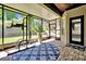 Screened patio boasts brick floors and views of the backyard and patio at 5808 Oak Lake Trl, Oviedo, FL 32765