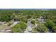 An aerial view of the community featuring mature trees and city skyline at 614 Johnson Dr, Ormond Beach, FL 32174