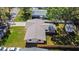 Aerial shot of a single-story home with a fenced yard and mature landscaping at 614 Johnson Dr, Ormond Beach, FL 32174