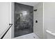 This bathroom features a sleek walk-in shower with dark gray tile and modern fixtures at 614 Johnson Dr, Ormond Beach, FL 32174