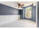 Comfortable bedroom with white tile floors, fresh paint, and a large window at 6794 Calistoga Cir, Port Orange, FL 32128