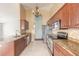 Well-equipped kitchen featuring stainless steel appliances, granite countertops, and ample cabinetry at 6794 Calistoga Cir, Port Orange, FL 32128
