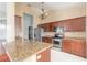 Modern kitchen with granite countertops, stainless steel appliances, and tile backsplash at 6794 Calistoga Cir, Port Orange, FL 32128