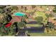 Aerial view showcasing a sparkling community pool with ample parking at 7 Appaloosa Trl, Ormond Beach, FL 32174