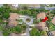 Aerial view of townhomes featuring mature trees and shared cul-de-sac at 7 Appaloosa Trl, Ormond Beach, FL 32174