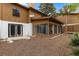 A view of the backyard with an enclosed porch and a sliding door with decorative metal grillwork at 7 Appaloosa Trl, Ormond Beach, FL 32174