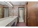 Bathroom featuring floral wallpaper, and a large vanity with a mirror at 7 Appaloosa Trl, Ormond Beach, FL 32174