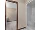 Bright bathroom featuring a shower and a view into an attached room at 7 Appaloosa Trl, Ormond Beach, FL 32174