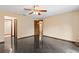 Bedroom with dark tile floors and ceiling fan at 7 Appaloosa Trl, Ormond Beach, FL 32174