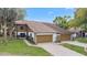 Charming two-story home with attached garages and well-maintained landscaping at 7 Appaloosa Trl, Ormond Beach, FL 32174