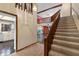 Foyer features stairs, chandelier and views into the spacious living room at 7 Appaloosa Trl, Ormond Beach, FL 32174