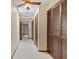 Hallway with a ceiling fan and skylight featuring lots of closet space at 7 Appaloosa Trl, Ormond Beach, FL 32174