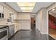 Traditional kitchen with stainless steel appliances and view into living room at 7 Appaloosa Trl, Ormond Beach, FL 32174