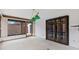 Bright living room featuring light fixtures and sliding doors to the yard at 7 Appaloosa Trl, Ormond Beach, FL 32174