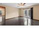Open living room featuring neutral paint, dark tile floors, and glass doors to the exterior at 7 Appaloosa Trl, Ormond Beach, FL 32174