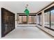 Living room featuring light fixtures, lots of windows, and a view of the yard at 7 Appaloosa Trl, Ormond Beach, FL 32174