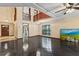 Open floor plan with a tile floor, chandelier, and large windows at 7 Appaloosa Trl, Ormond Beach, FL 32174