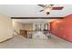 Bright loft area with wood railings, beams, and cozy carpet, creating an inviting space at 7 Appaloosa Trl, Ormond Beach, FL 32174